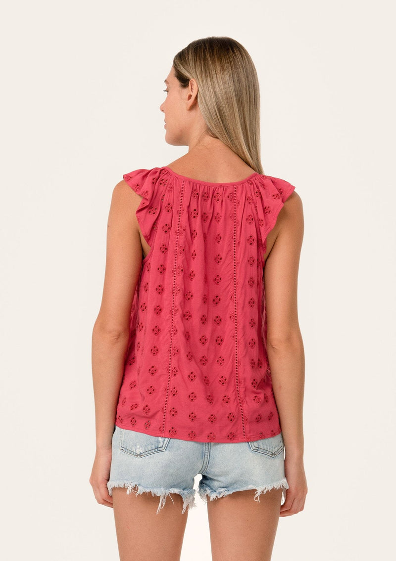 [Color: Fuchsia] A back facing image of a blonde model wearing a pink summer top with embroidered eyelet details. With a button front, flutter straps, and a scoop neckline.