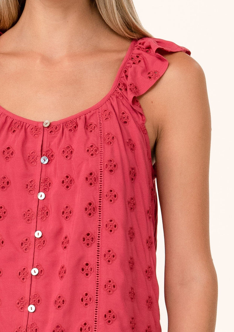[Color: Fuchsia] A close up front facing image of a blonde model wearing a pink summer top with embroidered eyelet details. With a button front, flutter straps, and a scoop neckline.