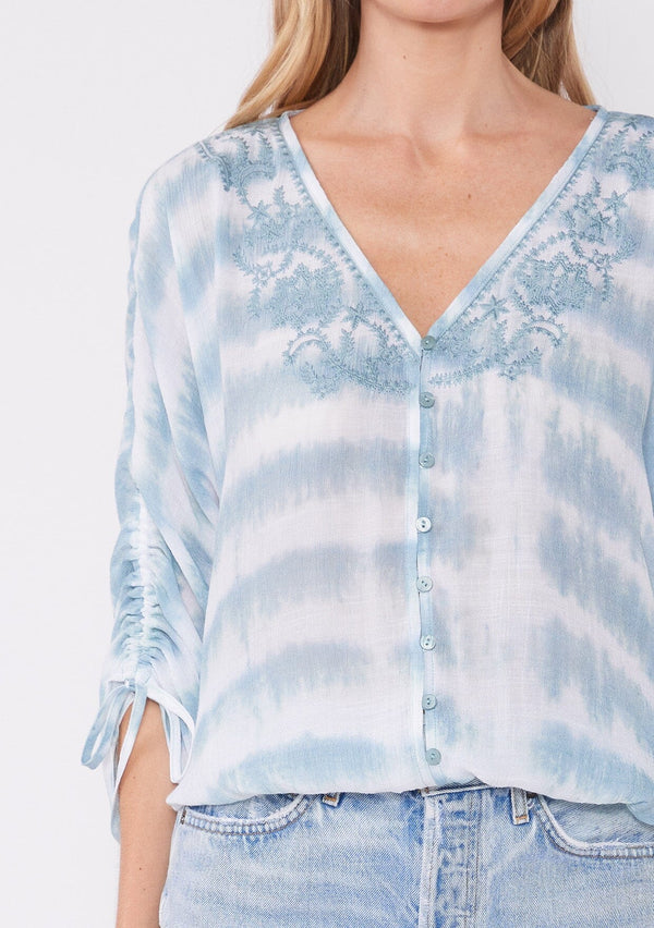 [Color: White/Teal] Breeze bohemian tie-dye teal blouse with embroidered details, ruched sleeves, a v-necklive and front buttons. The perfect boho summer blouse