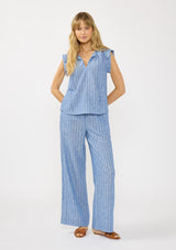 [Color: Blue] A front facing image of a blonde model wearing a blue striped top with a split v neckline, ties, and cap sleeves. Styled with a matching bottom. 