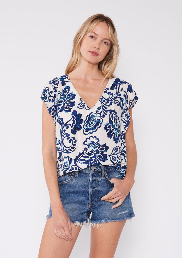 [Color: Vanilla/Navy] Floral tile print blouse with a v neck , flutter cap sleeves, and pleated shoulder detail. A casual summer top for any occasion. 