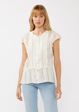 [Color: White/Coral] A front facing image of a blonde model wearing an off white yarn dye stripe top with embroidered eyelet details. This sheer cotton top features a round neckline, button front, short sleeves, and a peplum waist with an adjustable drawstring. Perfect for casual outings and resort styling. 