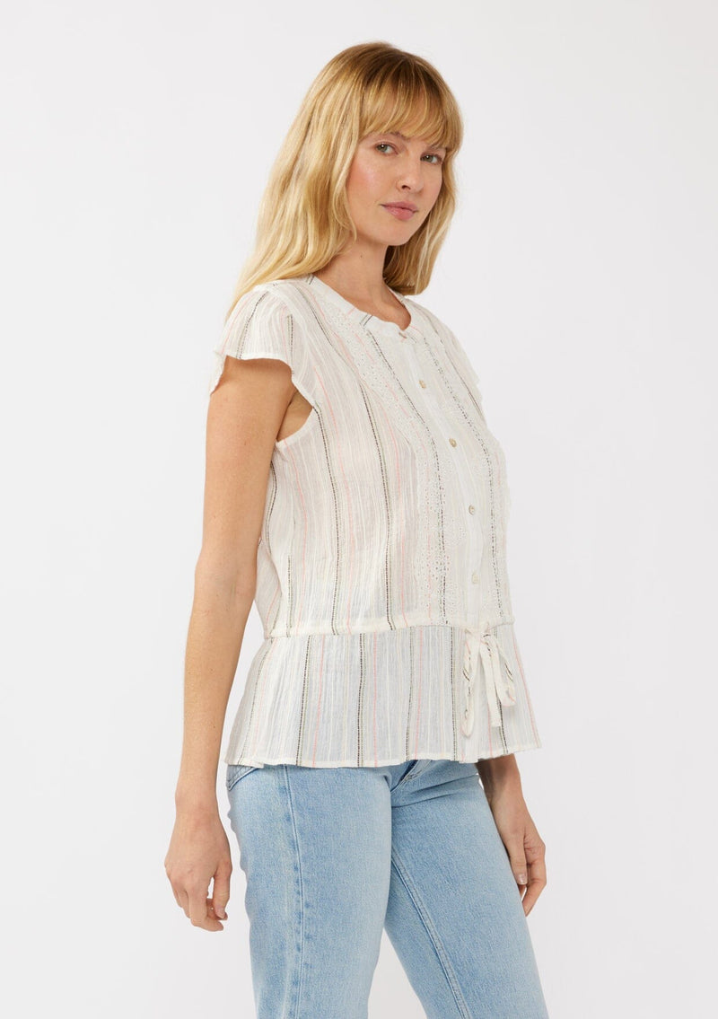 [Color: White/Coral] A side facing image of a blonde model wearing an off white yarn dye stripe top with embroidered eyelet details. This sheer cotton top features a round neckline, button front, short sleeves, and a peplum waist with an adjustable drawstring. Perfect for casual outings and resort styling. 