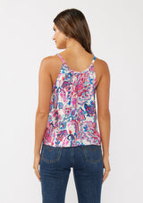 [Color: Natural/Dusty Pink] A back facing image of a brunette model wearing a spring floral cami with a scoop neckline, fixed straps, and a button front. 