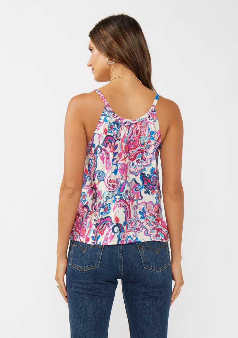 [Color: Natural/Dusty Pink] A back facing image of a brunette model wearing a spring floral cami with a scoop neckline, fixed straps, and a button front. 