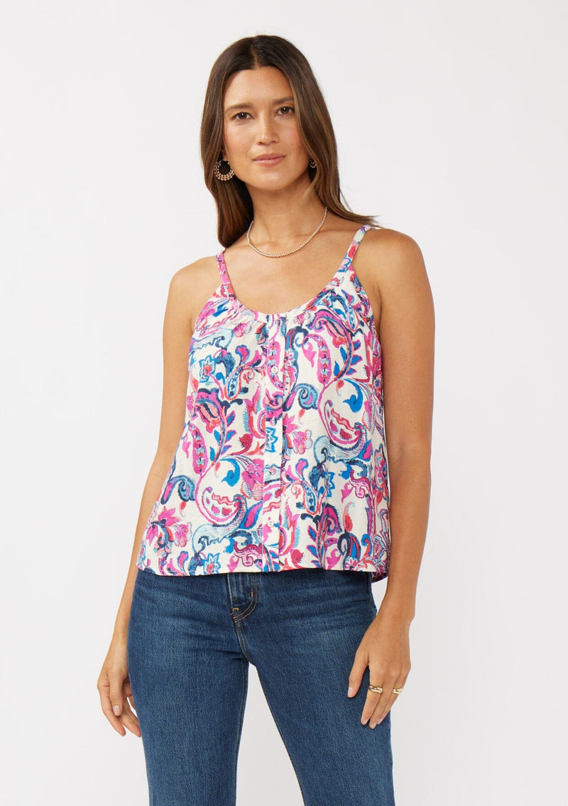 [Color: Natural/Dusty Pink] A front facing image of a brunette model wearing a spring floral cami with a scoop neckline, fixed straps, and a button front. 