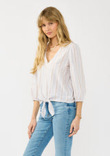 [Color: Sand/White] A side facing image of a blonde model wearing a summer striped tie front top with a v neckline and long sleeves.