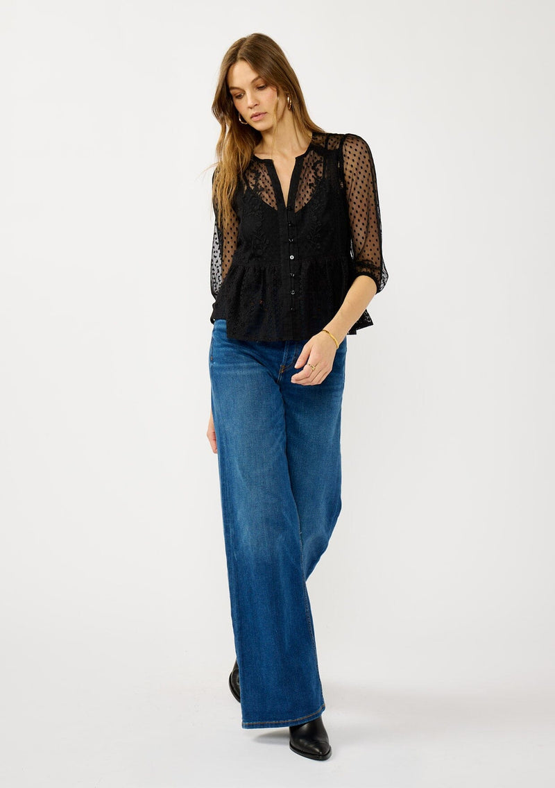 [Color: Black] A front facing image of a blonde model wearing a Victorian mixed lace top with 3/4 length sleeves, a split v-neckline, button front, and a subtle peplum-style silhouette. A versatile black fall lace top. 