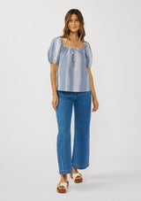 [Color: Navy/White] A front facing image of a brunette model wearing a blue and white checkered puff sleeve top with an elastic round neckline. 