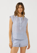 [Color: Blue/White] A front facing image of a brunette model wearing a blue and white striped top with rolled cap sleeves, a button front, and a mandarin collar.  
