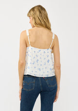 [Color: White/Blue] A back facing image of a white blue floral tank top with adjustable straps, lace trim, and a square neckline. 