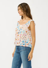 [Color: Ivory/Orange] A side facing image of a brunette model wearing a blue and orange floral top with cap sleeves and a smocked scoop neckline. 