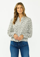 [Color: Black] A front facing image of a brunette model wearing a black and white checkered pattern blouse with embroidered details and a button front. 