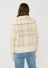 [Color: Ivory/Taupe] A back facing image of a brunette model wearing an ivory plaid jacket with a zip up front and side pockets. 