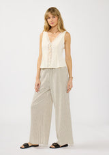 [Color: Natural/Black] A front facing image of a blond model wearing a lace top with a beige bottom with black stripes. Featuring an elastic waist with a drawstring and side pockets. 