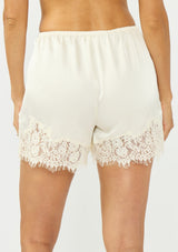[Color: Champagne] A front facing image of an off white satin lace short with an elastic back waist. 