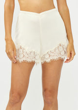 [Color: Champagne] A front facing image of an off white satin lace short. 
