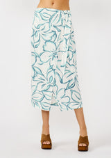 [Color: Ivory/Dark Teal] A front facing image of a model wearing a white and teal tropical floral print wrap skirt, tie waist, and a smocked back. Styled with a matching tie front top. Perfect for vacation or casual outings. 