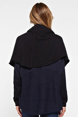[Color: Navy/Black] A back facing image of a blonde model wearing a dip dyed cocoon cardigan with a shawl collar and long sleeves. A versatile cardigan that can transition from a duster to a mid-length cardigan. 