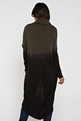 [Color: Olive/Black] A back facing image of a blonde model wearing a dip dyed cocoon cardigan with a shawl collar and long sleeves. A versatile cardigan that can transition from a duster to a mid-length cardigan. 