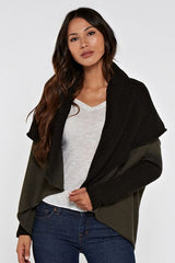 [Color: Olive/Black] A front facing image of a blonde model wearing a dip dyed cocoon cardigan with a shawl collar and long sleeves. A versatile cardigan that can transition from a duster to a mid-length cardigan. 