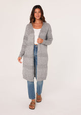 [Color: Heather Grey] A brunette woman modeling a long, open-front gray mélange knit cardigan over a white top and blue jeans.