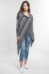 [Color: Heather Grey/Black] An image of a model wearing a striped shawl cardigan with a fringe trim and wrap button closure. 
