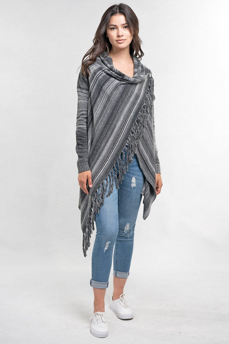 [Color: Heather Grey/Black] An image of a model wearing a striped shawl cardigan with a fringe trim and wrap button closure. 
