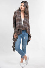 [Color: Heather Mink/Grey] An image of a model wearing a striped shawl cardigan with a fringe trim and wrap button closure. 