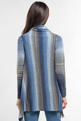 [Color: Heather Ocean/Grey] An image of a model wearing a striped shawl cardigan with a fringe trim and wrap button closure. 