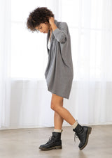 [Color: Heather Charcoal] A brunette model wearing a slouchy cardigan with a cocoon fit, shawl collar drape, and long dolman sleeves. This relaxed style is the perfect casual staple for any fall wardrobe. 