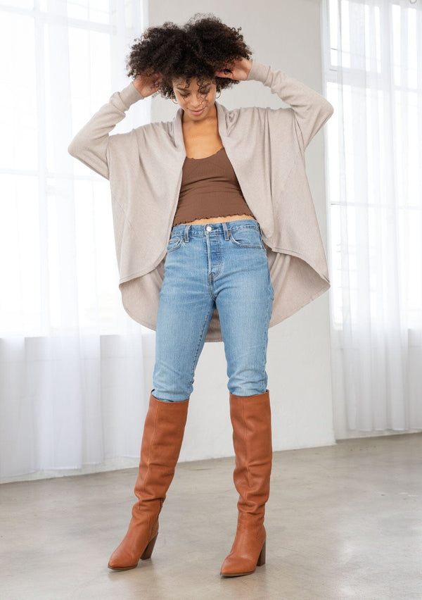 [Color: Heather Stone] A brunette model wearing a slouchy cardigan with a cocoon fit, shawl collar drape, and long dolman sleeves. This relaxed style is the perfect casual staple for any fall wardrobe. 