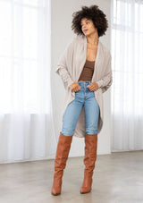 [Color: Heather Stone] A brunette model wearing a slouchy cardigan with a cocoon fit, shawl collar drape, and long dolman sleeves. This relaxed style is the perfect casual staple for any fall wardrobe. 