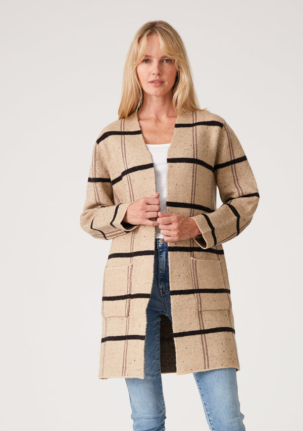 [Color: Khaki/Black] A full body front facing image of a brunette model wearing a soft mid length cardigan in a khaki brown and black windowpane plaid. With long sleeves, deep side pockets, and an open front.
