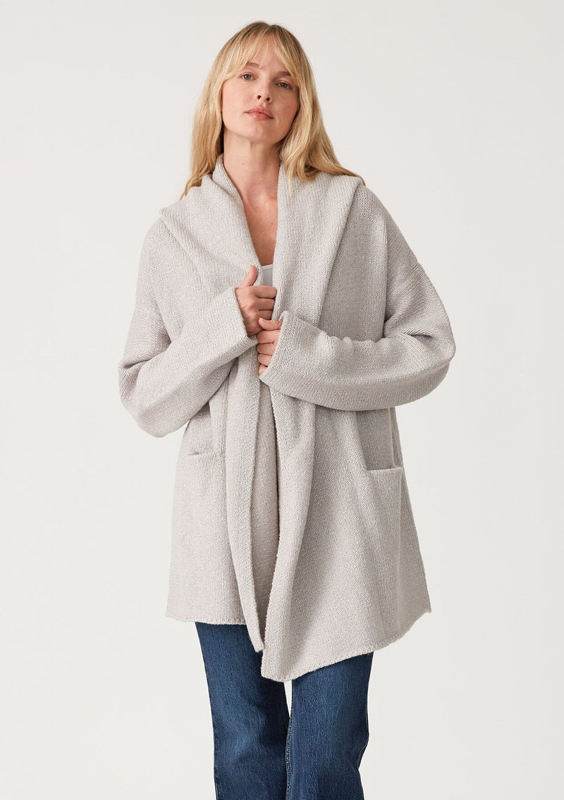[Color: Heather Grey] A front facing image of a blonde model wearing an oversized sweater coat in heather grey. With an oversized hood, long sleeves, an open front, side pockets, and a mid length. 
