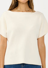 [Color: Natural] A detail image of a brunette model wearing a white sweater top with short sleeves and a boat neckline. 