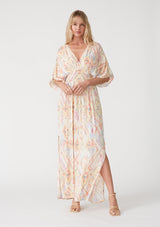 [Color: Butter/Coral] A front facing image of a blonde model wearing a best selling bohemian resort maxi dress in a yellow bohemian diamond print. With half length kimono sleeves, a deep v neckline in the front and back, a back tie closure, a smocked elastic waist, side slits, and a long flowy skirt. 