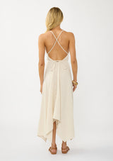 [Color: Cream] A sexy strappy cream halter dress in airy cotton gauze. With a plunging v neckline, handkerchief hemline, and long straps that can be tied in multiple ways.