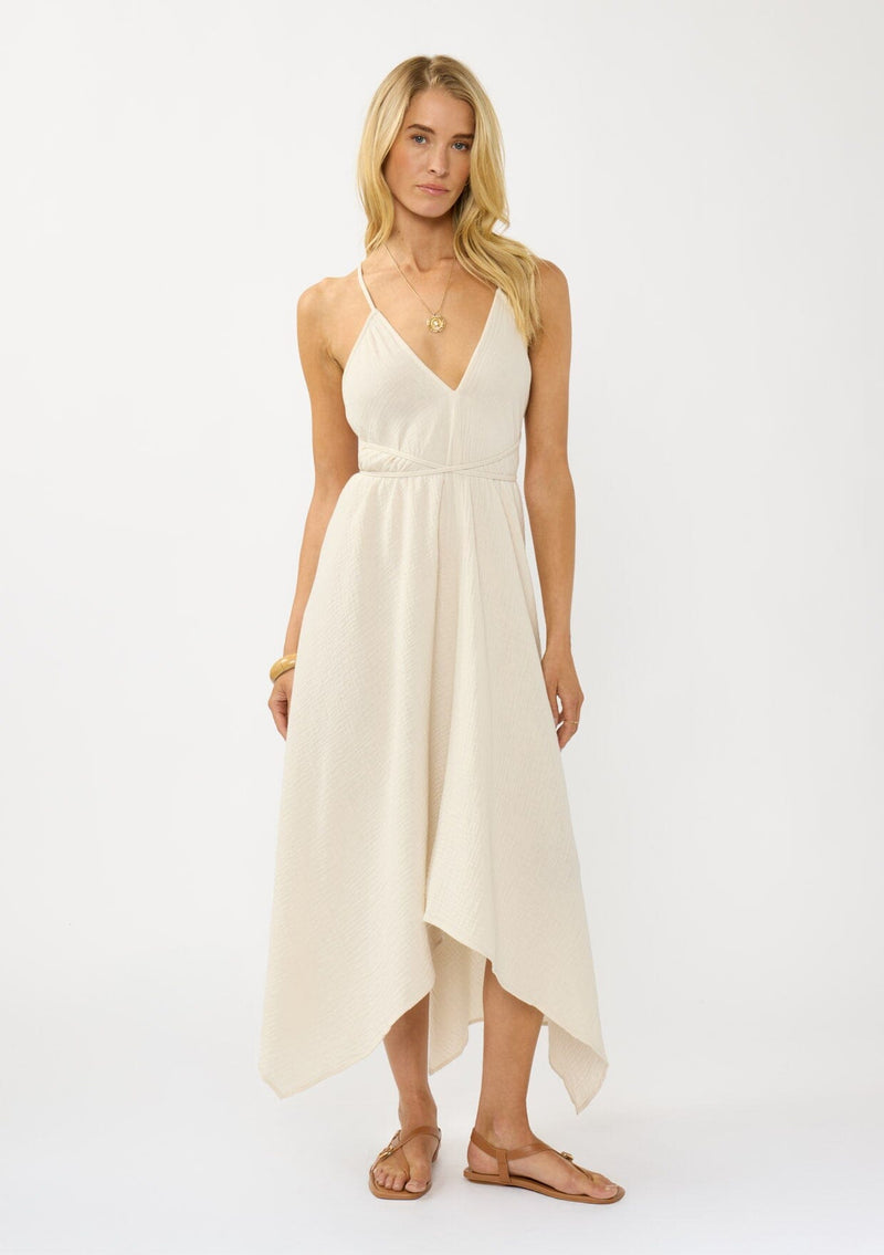 [Color: Cream] A sexy strappy cream halter dress in airy cotton gauze. With a plunging v neckline, handkerchief hemline, and long straps that can be tied in multiple ways.
