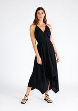 [Color: Black] A sexy strappy black halter dress in airy cotton gauze. With a plunging v neckline, handkerchief hemline, and long straps that can be tied in multiple ways.
