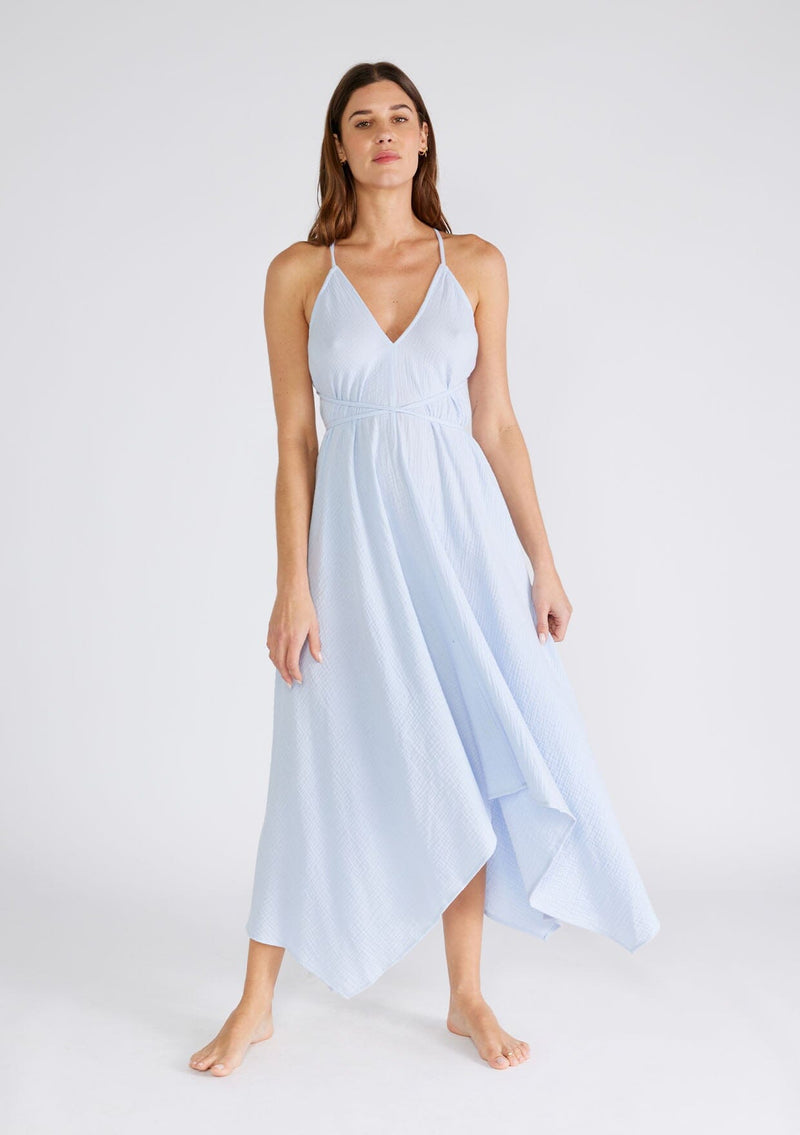 [Color: Dusty Blue] A sexy strappy light blue halter dress in airy cotton gauze. With a plunging v neckline, handkerchief hemline, and long straps that can be tied in multiple ways.