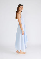 [Color: Dusty Blue] A sexy strappy light blue halter dress in airy cotton gauze. With a plunging v neckline, handkerchief hemline, and long straps that can be tied in multiple ways.
