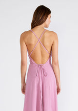 [Color: Orchid] A sexy strappy light purple halter dress in airy cotton gauze. With a plunging v neckline, handkerchief hemline, and long straps that can be tied in multiple ways.