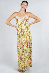 [Color: Corn Combo] A woman wearing a yellow floral lace dress. With a tiered skirt, a lace trim v neckline and racer back, and adjustable spaghetti straps.