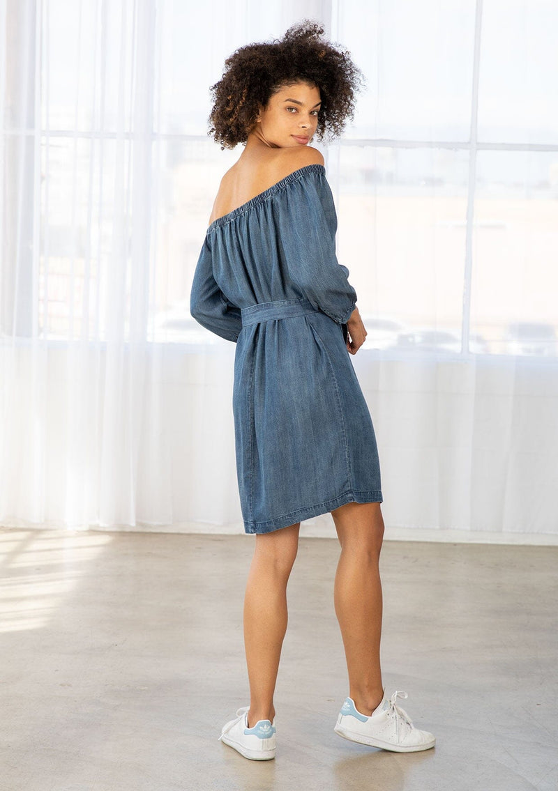 [Color: Dk Vintage Wash] An off shoulder mini dress crafted from blue tencel fabric. 