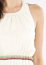 [Color: Natural/Multi] A detail image of a brunette model wearing an off white sleeveless maxi dress with embroidered accents. 
