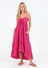 [Color: Mulberry] A model wearing an ultra flowy sleeveless maxi dress, featuring a sweetheart neckline, an empire waist, and ruffled details. Perfect beach dress. 
