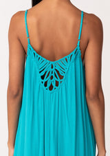 [Color: Turquoise] A close up back facing image of a brunette model wearing a turquoise blue summer bohemian maxi tank dress. With adjustable spaghetti straps, a v neckline, a flowy fit, and a soutache braided detail at the back. 