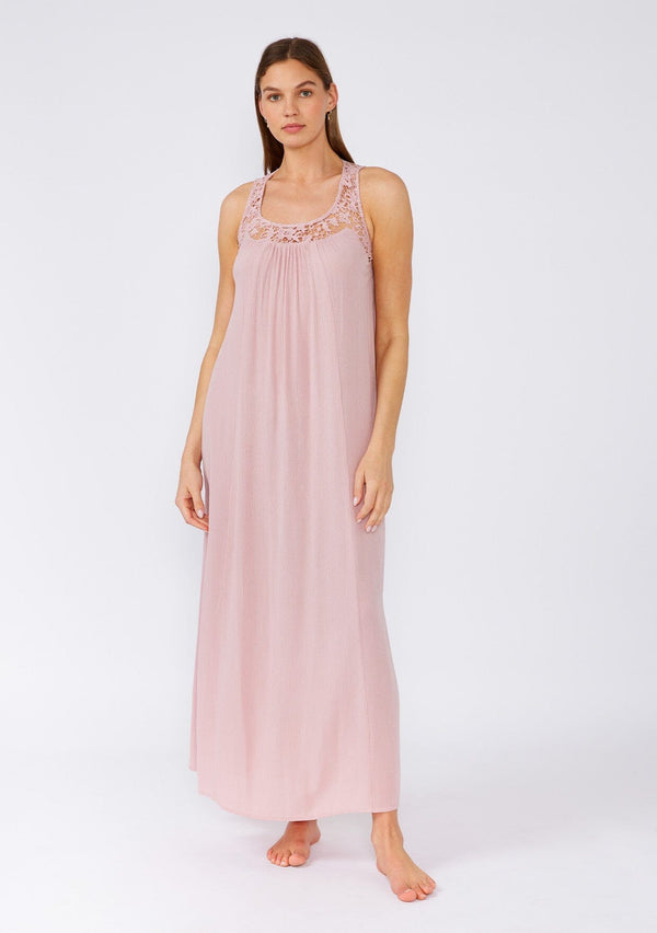 [Color: Dusty Rose] A front facing image of a brunette model wearing a flowy sleeveless bohemian maxi dress in dusty pink. With a crochet top, a scooped neckline, and an open back detail. 