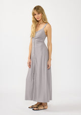 [Color: Dove Grey] A front facing image of a brunette model wearing a classic grey maxi dress. This linen blend maxi features a button front, side pockets, and a smocked back.